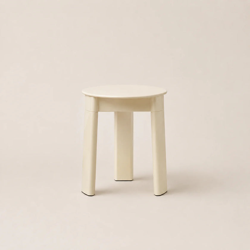 White stool on a beige background