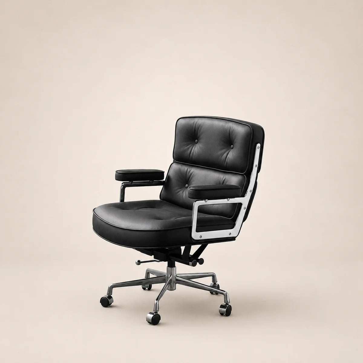 Black office chair with chrome accents on a beige background