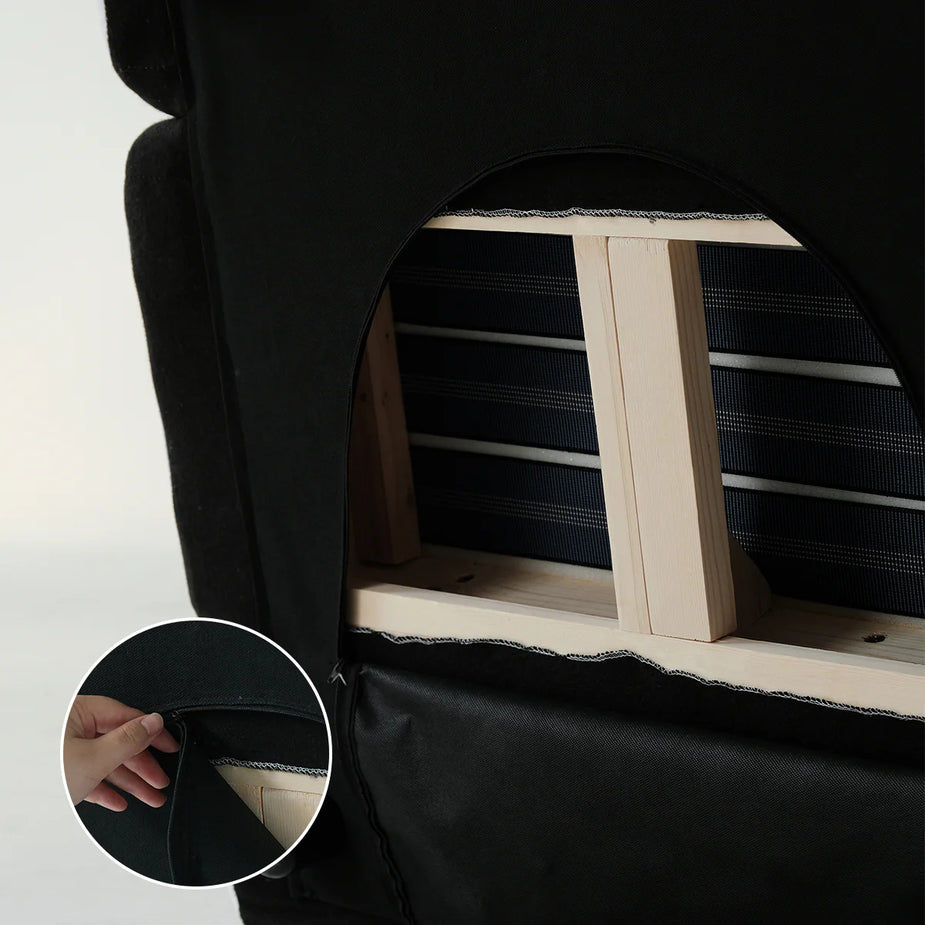 Black pet carrier with wooden steps and a close-up of a hand opening it.