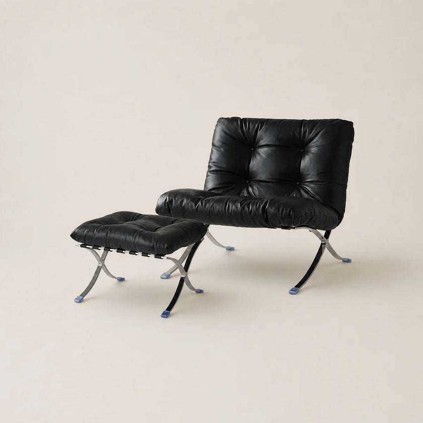 Black leather chair and ottoman set on a beige background