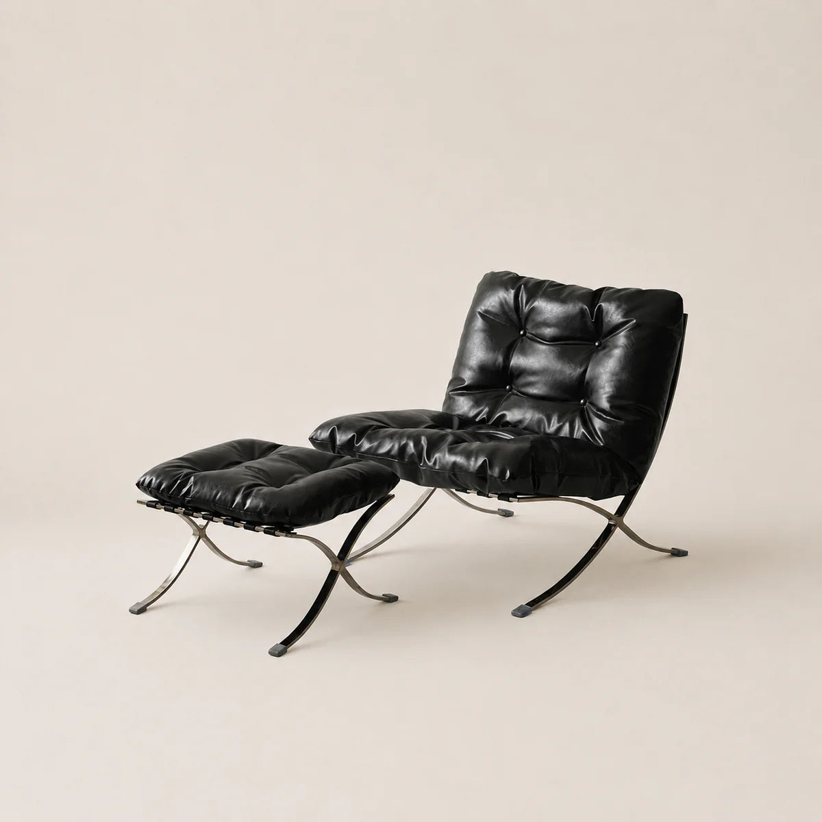 Black leather armchair with ottoman on a beige background