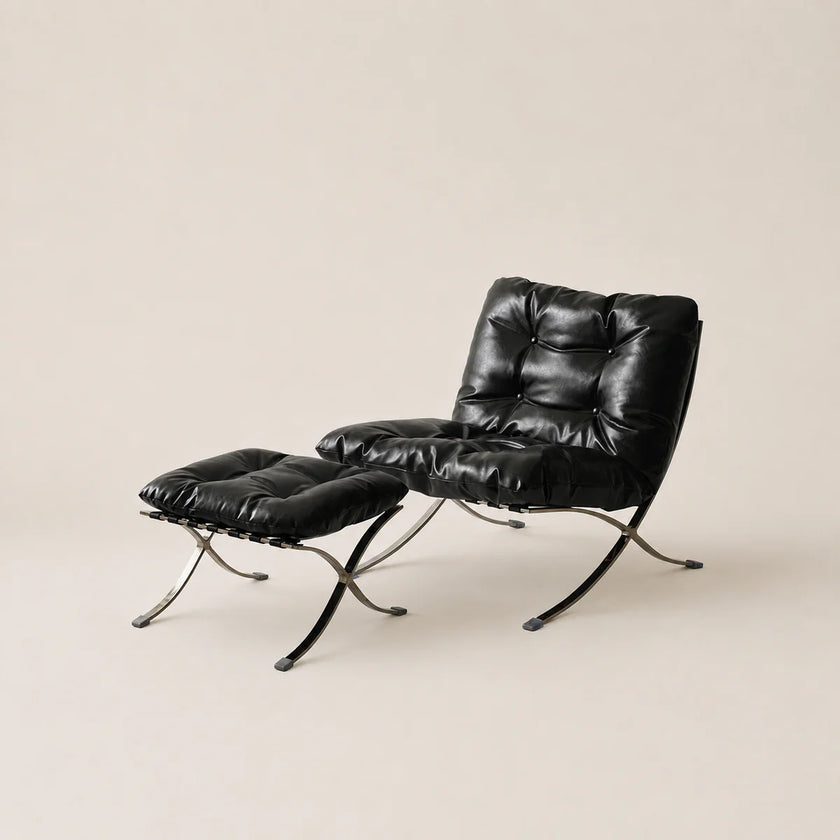 Black leather armchair with ottoman on a beige background