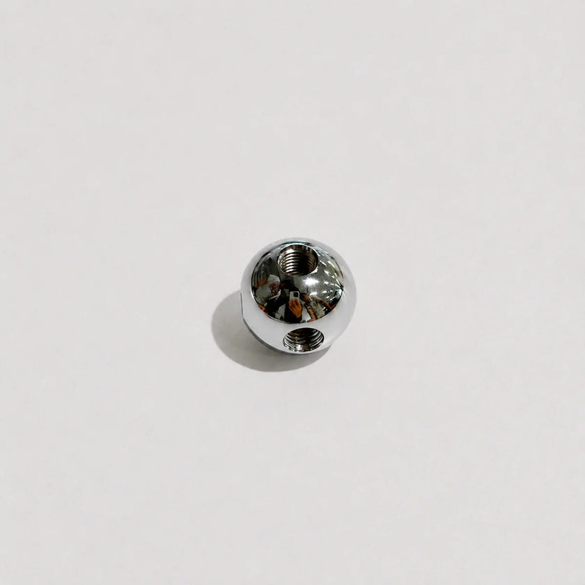 A single small 8K polished metal bead or charm with a threaded hole, shown on a plain light gray background.