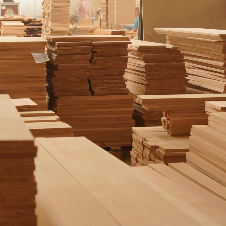 Stacks of wooden panels in a warehouse setting