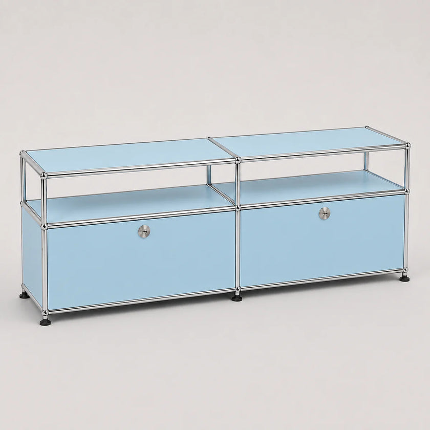A light blue modular storage cabinet with a chrome metal frame, featuring two lower doors with round silver knobs and two upper glass shelves, set against a neutral light gray background.