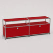 A modern two-segment media console or storage cabinet with a vibrant red finish and a chrome tubular metal frame, featuring two circular silver knobs on the lower doors.