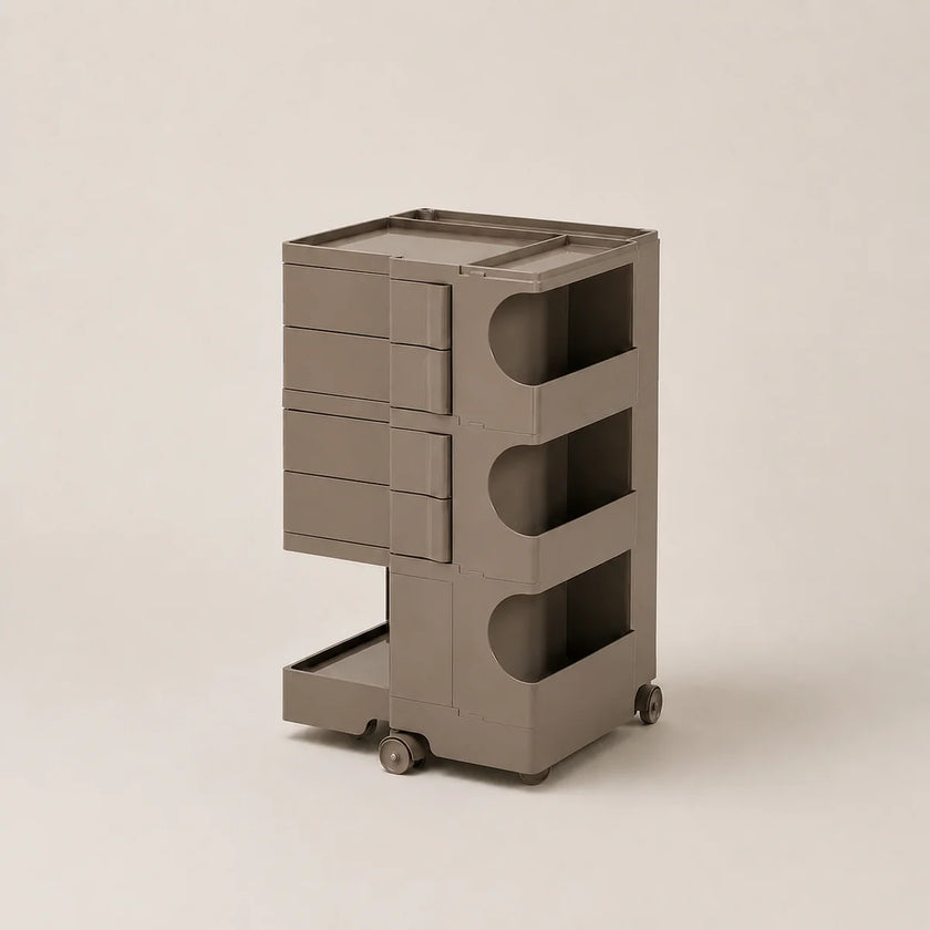 A modern, minimalist three-tier rolling storage cart in a brown color, featuring four drawers on the left, three open shelves with curved cutouts on the right, and a lower pull-out tray on wheels, set against a solid light beige background.