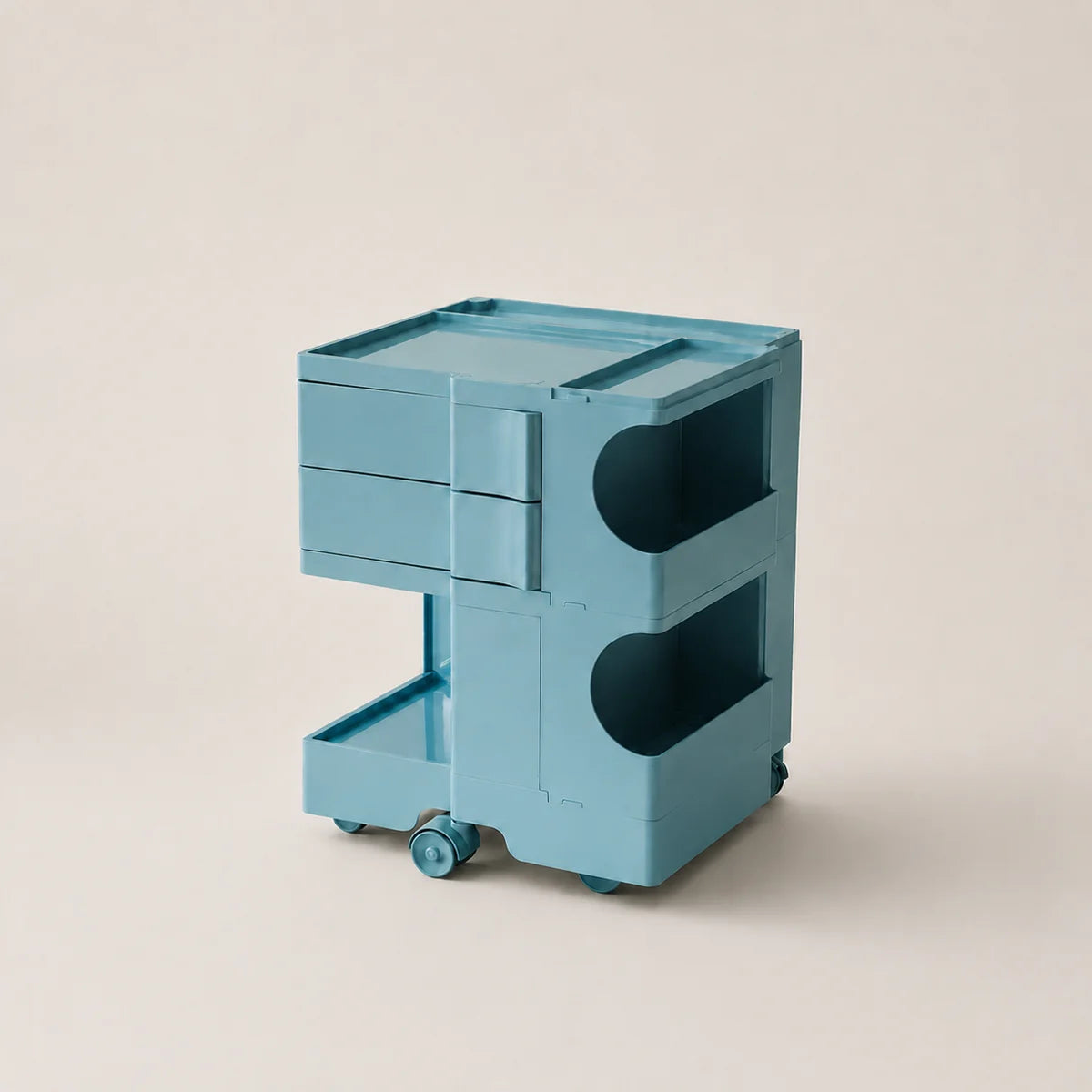Macaron blue storage cart with wheels on a beige background.