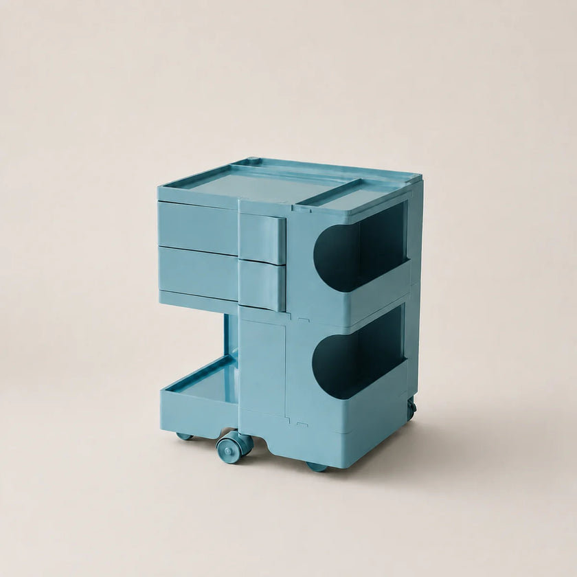 Macaron blue storage cart with wheels on a beige background.