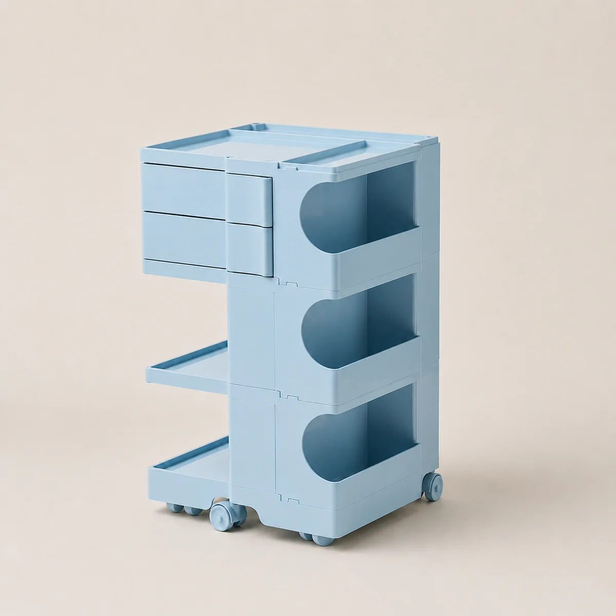 A light blue ABS plastic rolling organizer cart with two drawers, two open shelves, and three circular peg holes on the side, shown on a solid beige background.