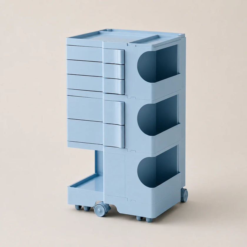 A light blue storage cart with multiple drawers, open shelves, and caster wheels, shown on a plain beige studio background.