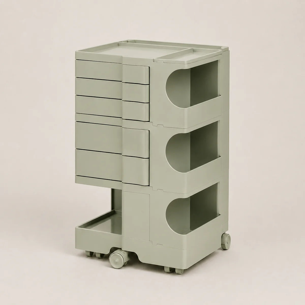 A light sage green storage cart with multiple drawers, open shelves, and a top tray, shown on a plain light beige background.