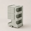 A light sage green ABS rolling storage cart with multiple drawers and open shelves, shown on a plain light beige background.