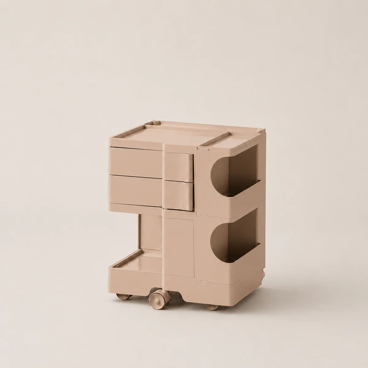 A minimalist beige rolling storage cabinet with two drawers on the top and two open shelves on the bottom, shown on a plain warm beige background.