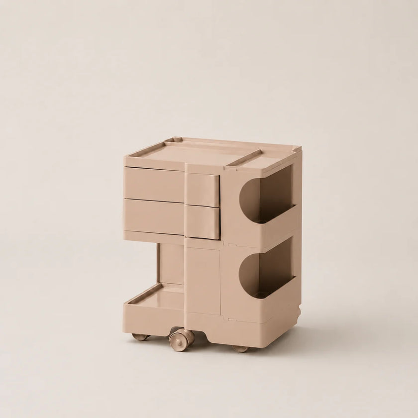 A minimalist beige rolling storage cabinet with two drawers on the top and two open shelves on the bottom, shown on a plain warm beige background.
