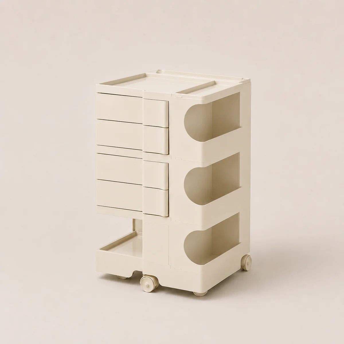 A cream-colored plastic rolling storage organizer with four drawers on the left and three open shelves on the right, set against a solid light beige background.