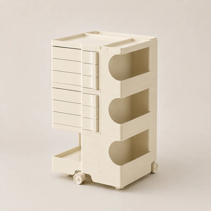 An off-white ABS rolling organizer cart with six drawers on the left and three open storage compartments on the right, set against a solid light beige background.