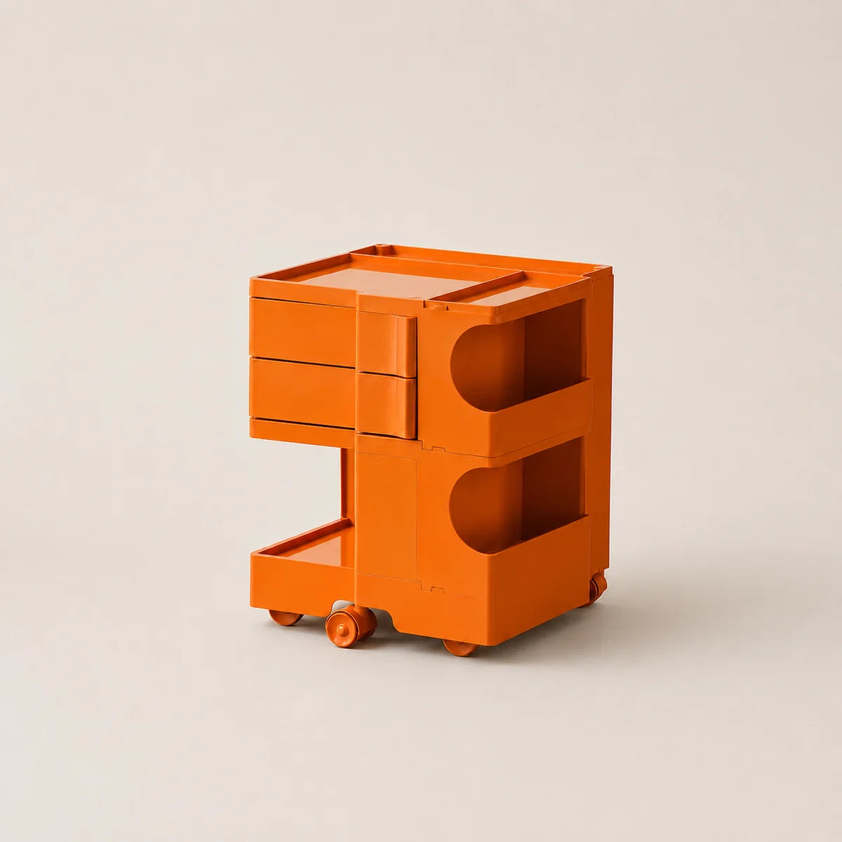An orange ABS plastic storage cart with two drawers on the left, two open shelves on the right, and small wheels at the base, photographed on a light beige studio background.