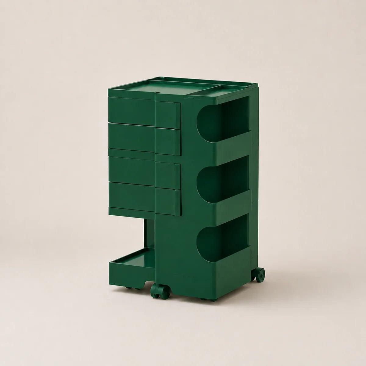 A dark green rolling storage cart with multiple drawers and open shelves, photographed on a plain light beige studio background.