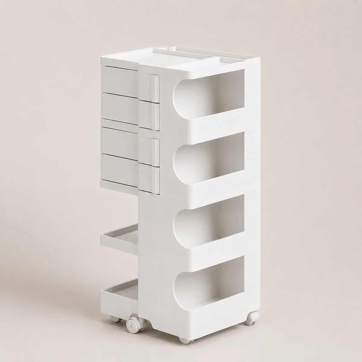 A white rolling storage organizer with four drawers on the left and four open shelves with curved cutouts on the right, shown on a plain beige studio background.