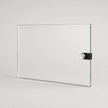A clear rectangular glass board with a black and silver magnetic clip on the right side, shown on a light gray background.