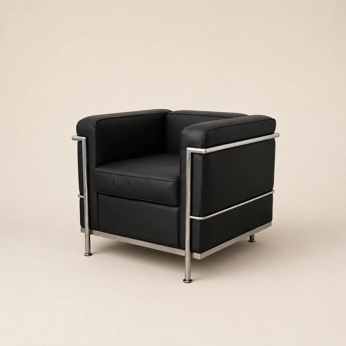 A mid-century modern armchair with black leather upholstery and a polished chrome steel frame, shown against a solid warm beige background.
