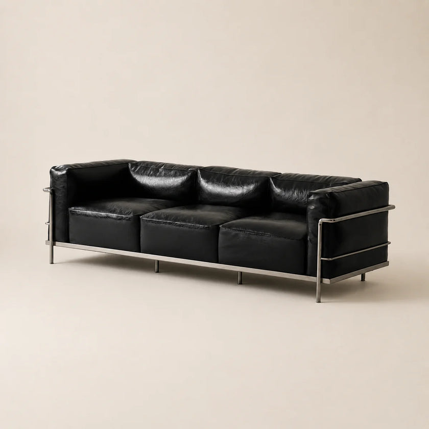 Black waxe microfiber leather three seats armchair with metal legs on a white background