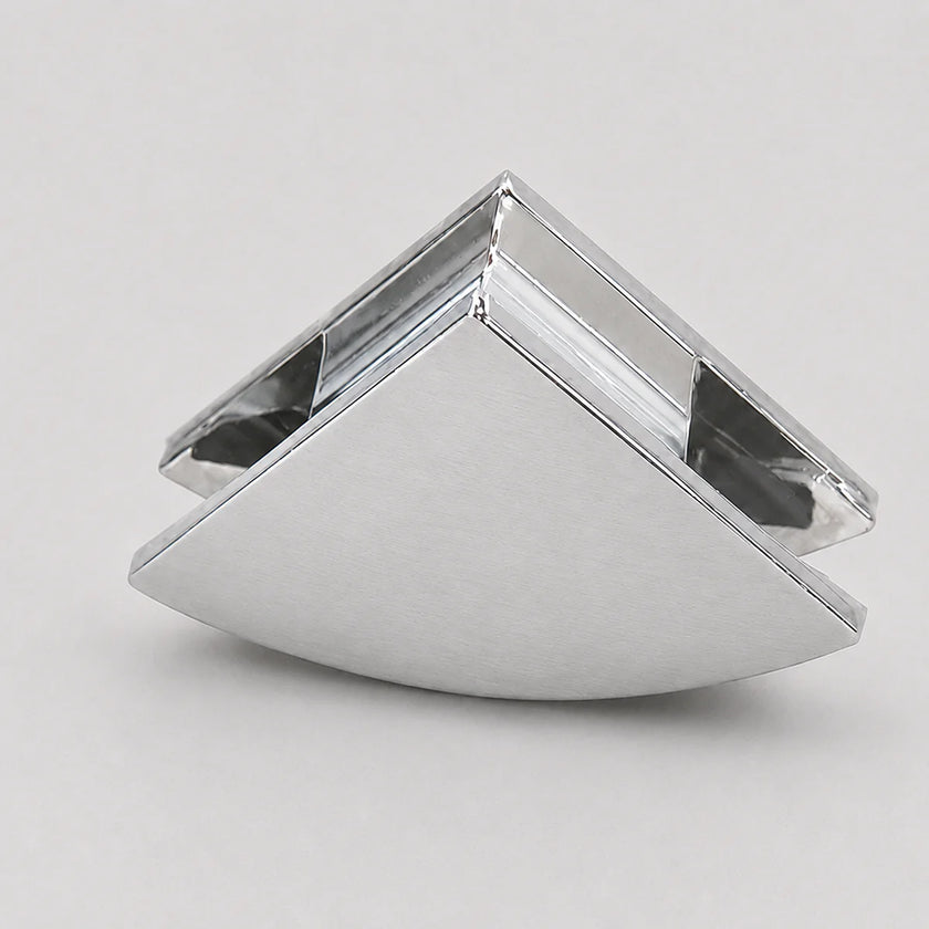 A modern geometric triangular wall hook or cabinet pull in a brushed silver metal finish, shown on a neutral light gray background.