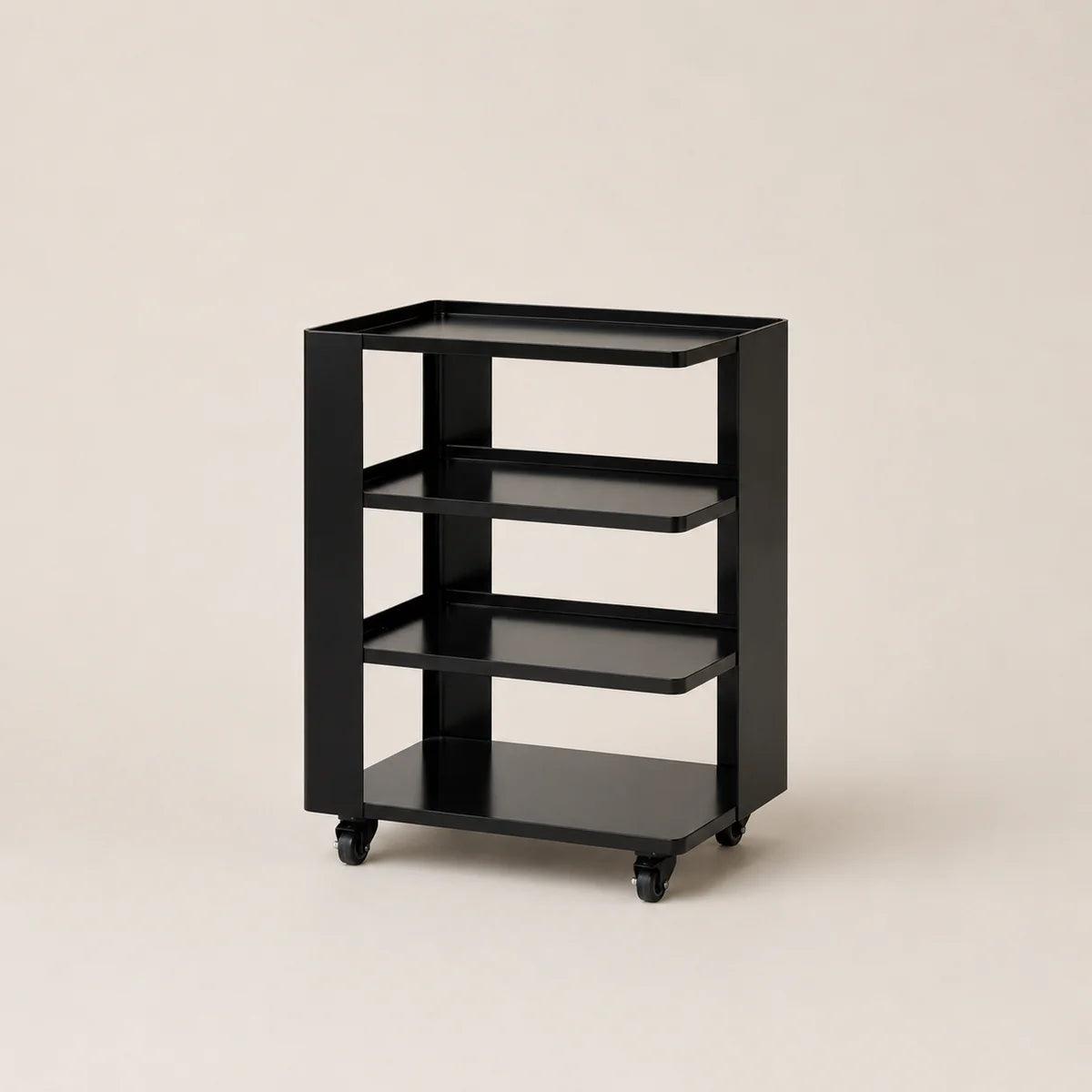 Black metal shelf with three shelves on wheels against a beige background