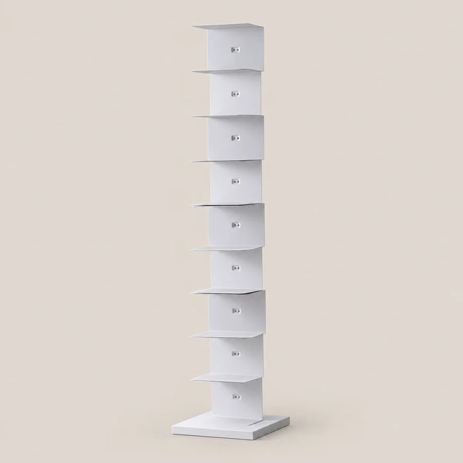 A tall, narrow white display stand with multiple tiered shelves, shown on a plain warm beige background.