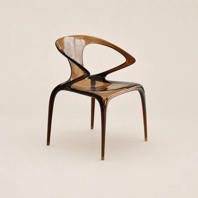 Modern chair with a transparent backrest on a beige background