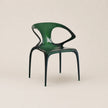 Green chair on a beige background