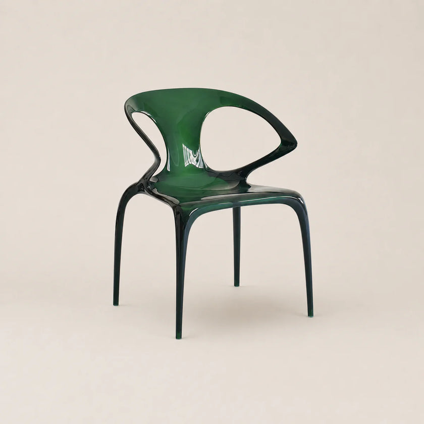 Green chair on a beige background
