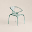 Clear plastic chair on a beige background