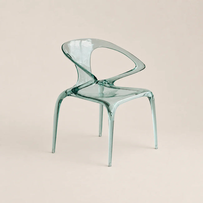 Clear plastic chair on a beige background