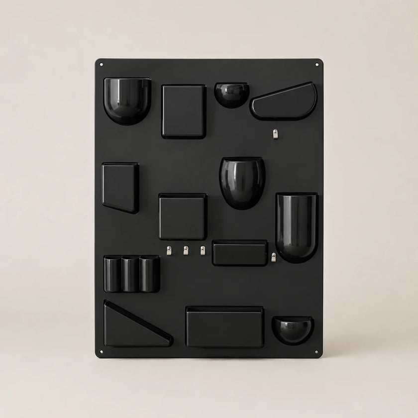 Black metal wall art with geometric shapes on a beige background