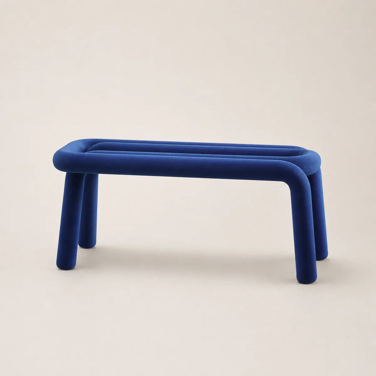 Blue stool on a beige background