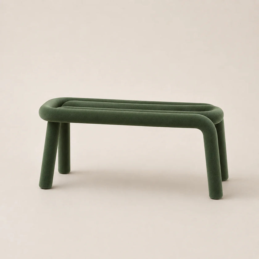 Green stool with curved legs on a beige background