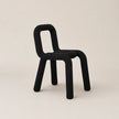 Black chair on a beige background