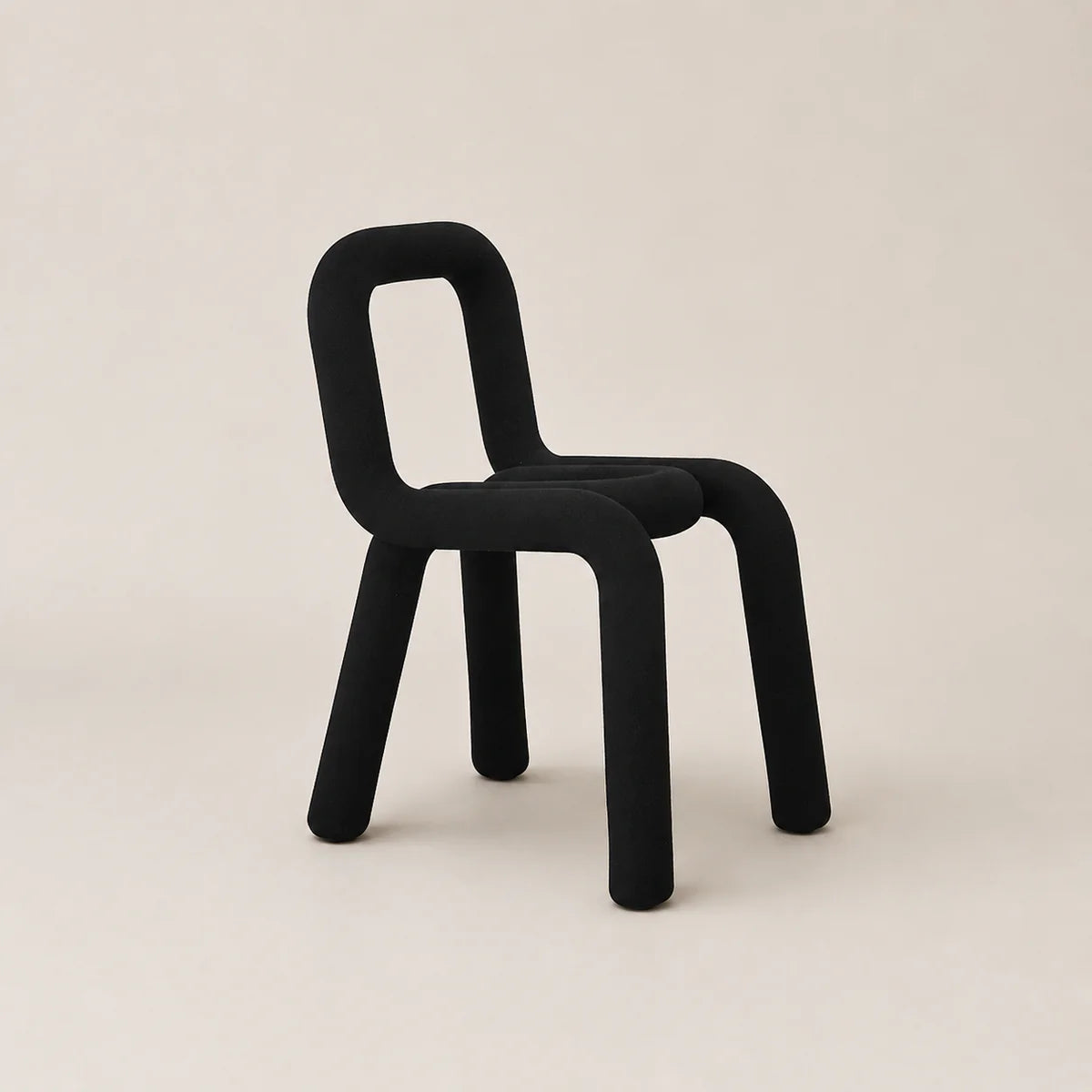 Black chair on a beige background