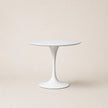 White round table on a beige background