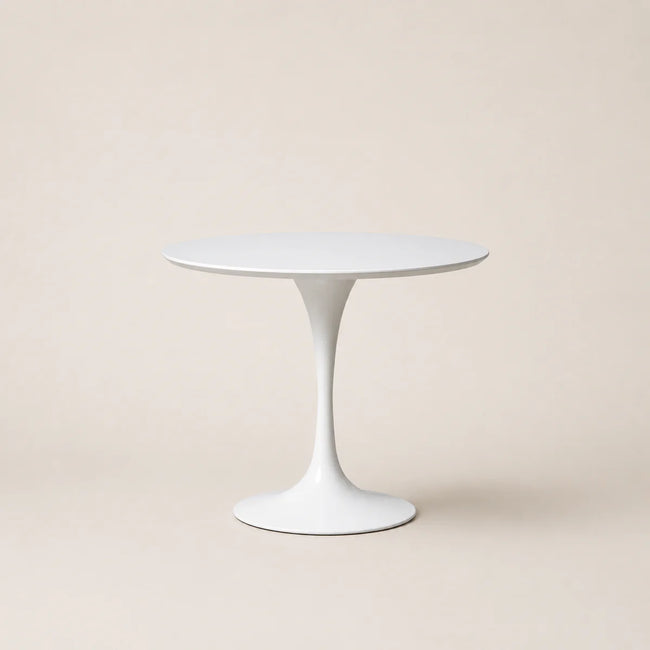 White round table on a beige background