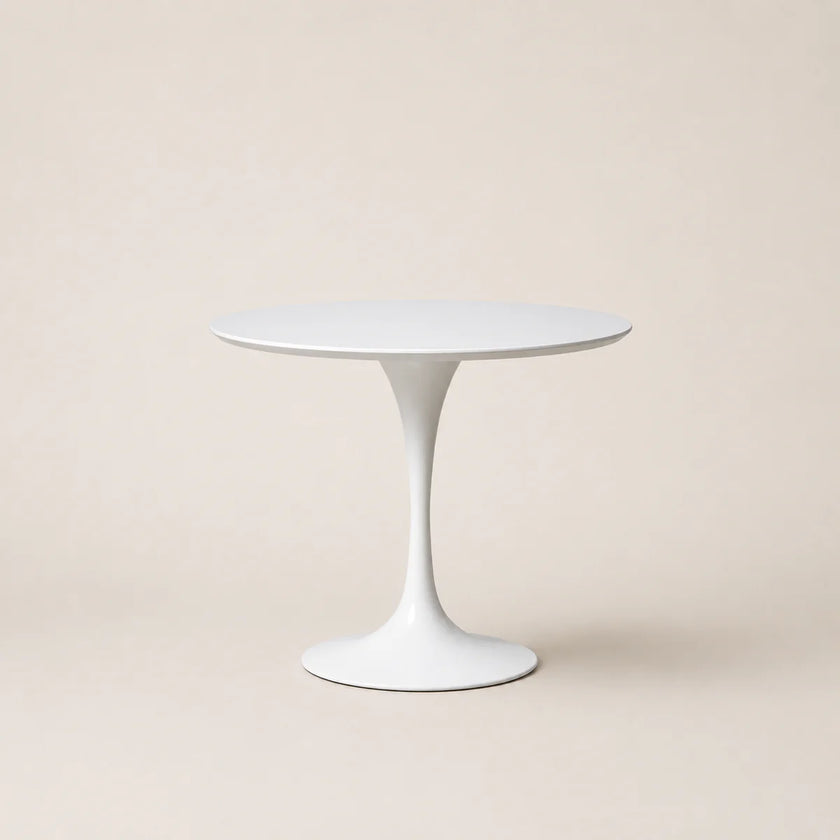 White round table on a beige background