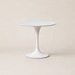 White round table on a beige background