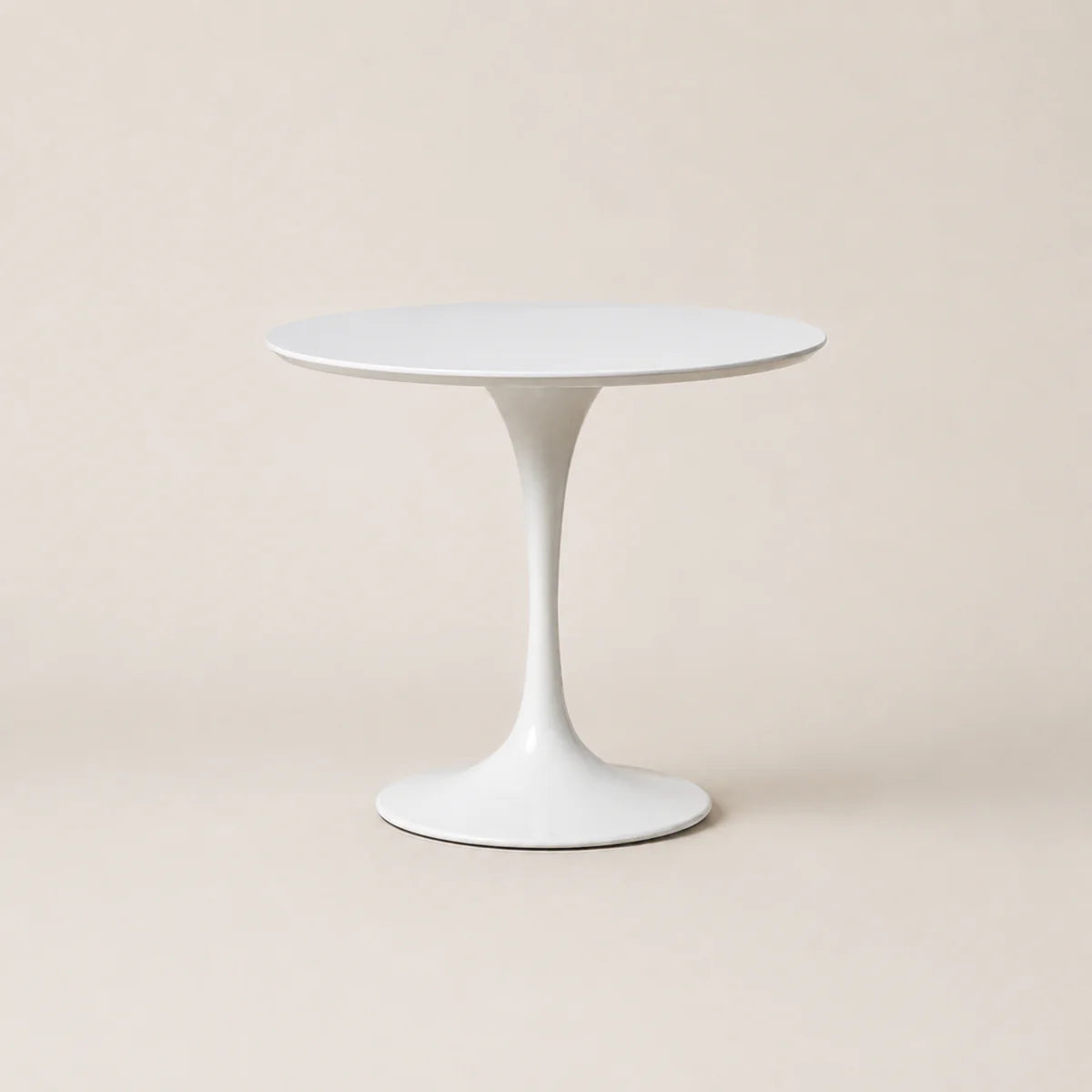 White round table on a beige background