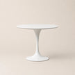White round table on a beige background