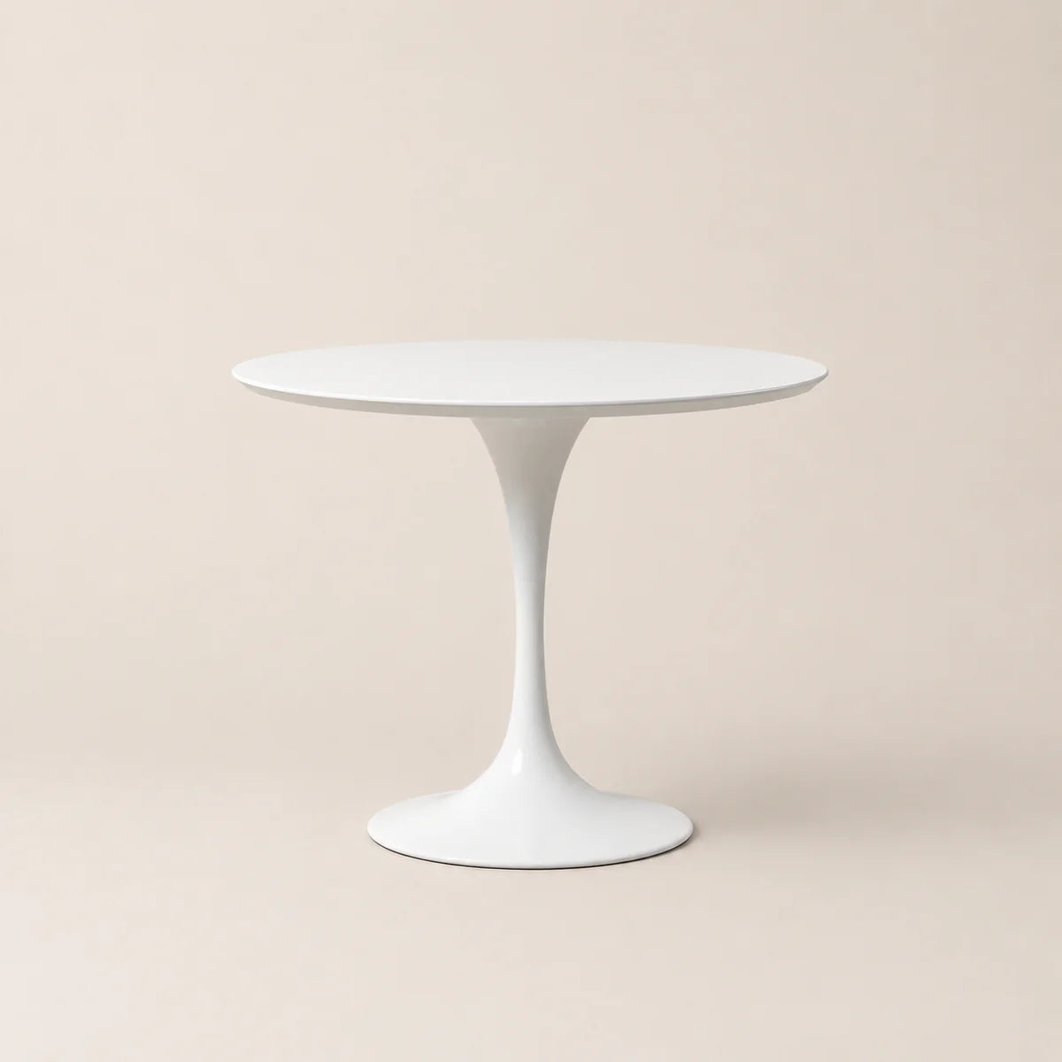 White round table on a beige background