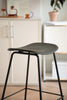 Black bar stool with black legs in a kitchen setting