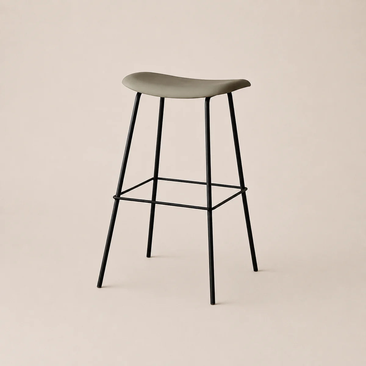 Bar stool with a green seat and black metal legs on a beige background
