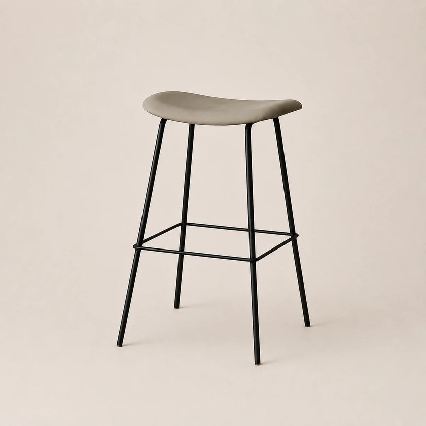Bar stool with a gray seat and black metal legs on a beige background